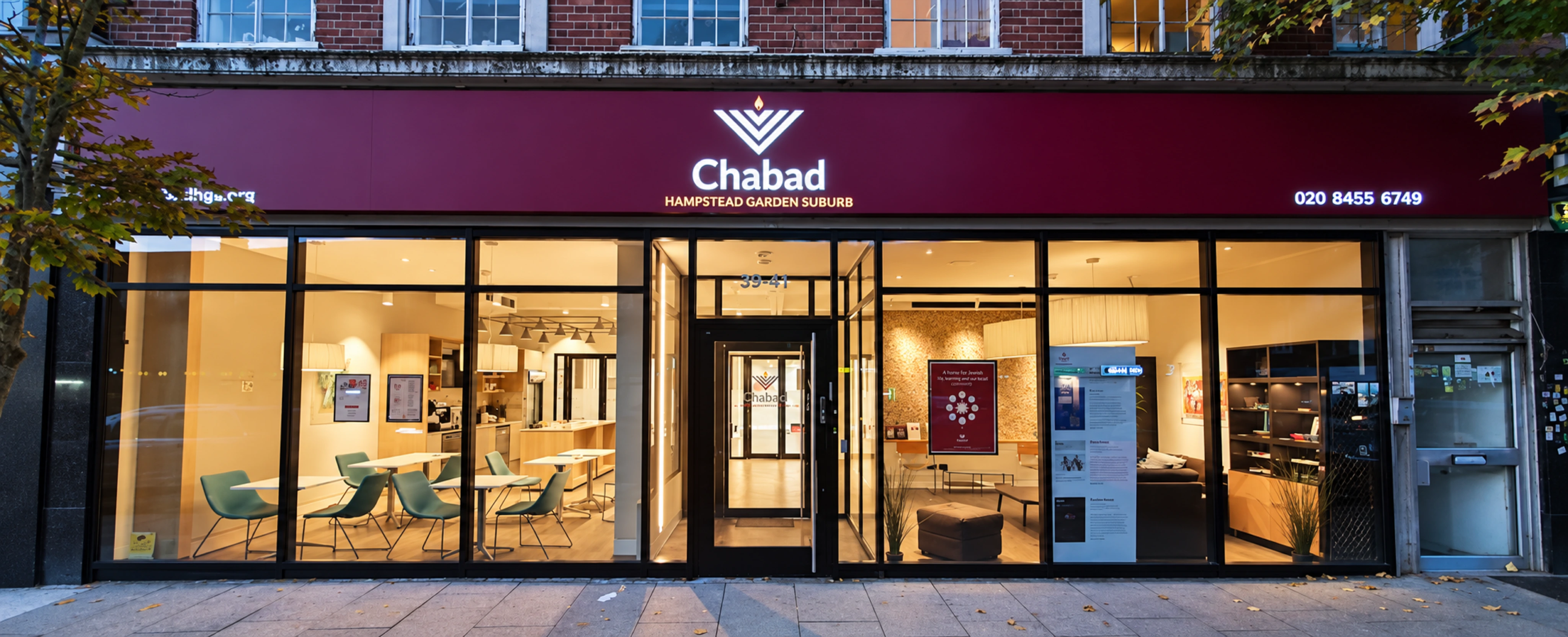 The illuminated Chabad Hampstead Garden Suburb frontage on Falloden Way