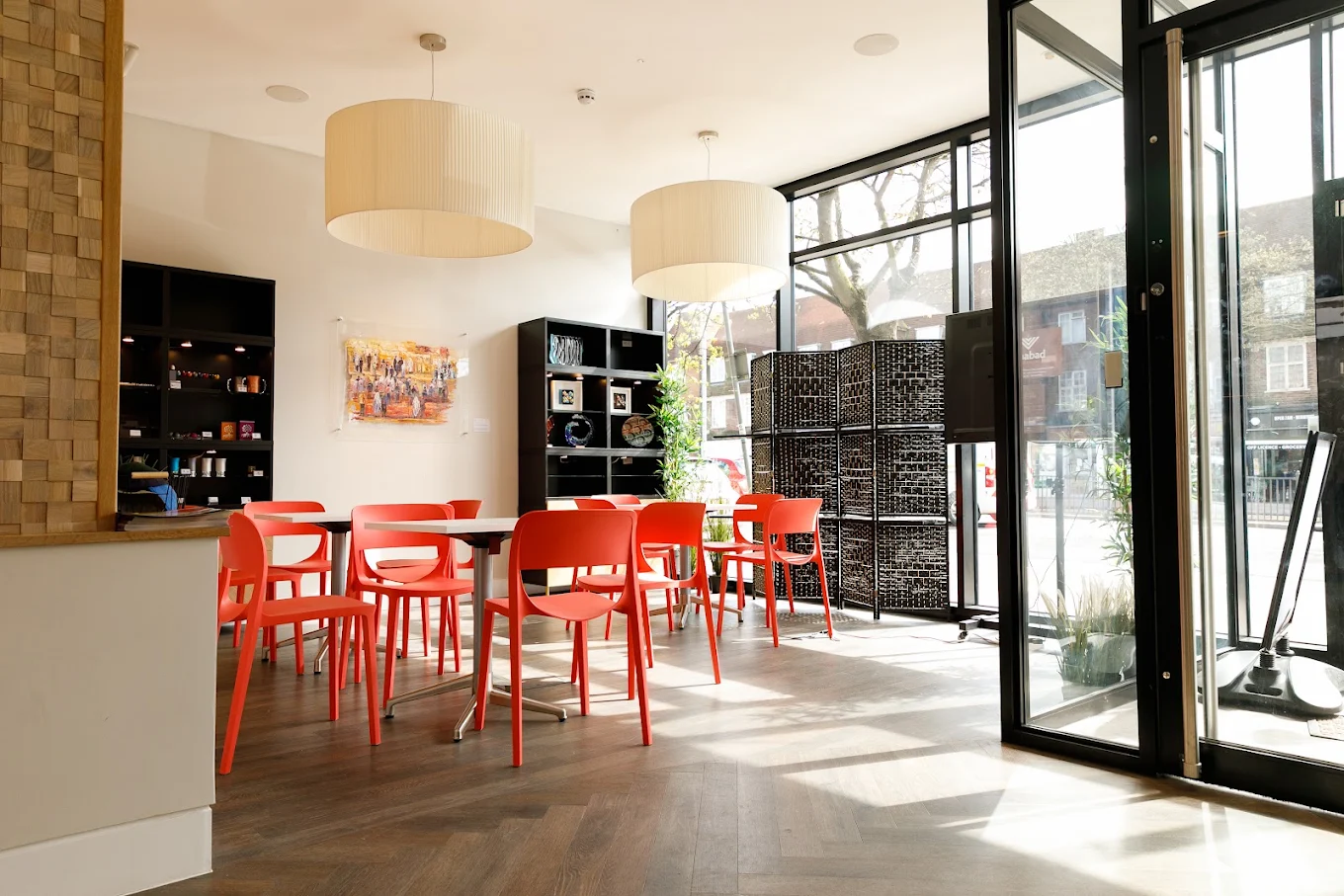 Street-facing seating, pendant lights and full-height glazing at Chabad HGS