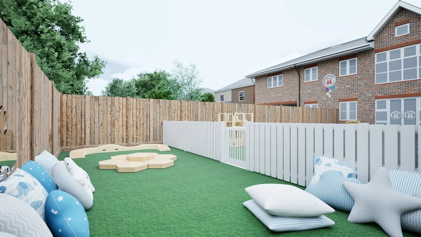 Outdoor nursery terrace with cushions and low fencing beside the brick building