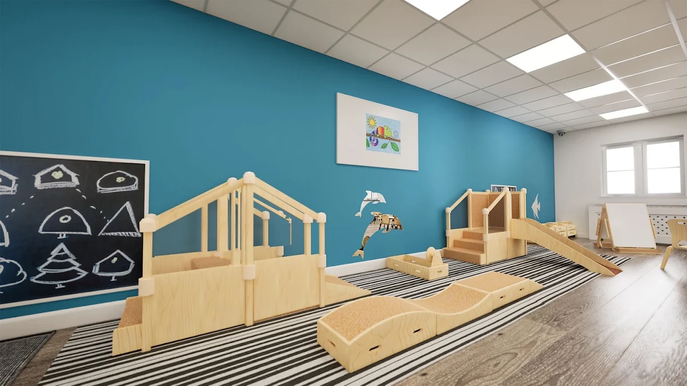 Indoor timber climbing ramp against a teal feature wall