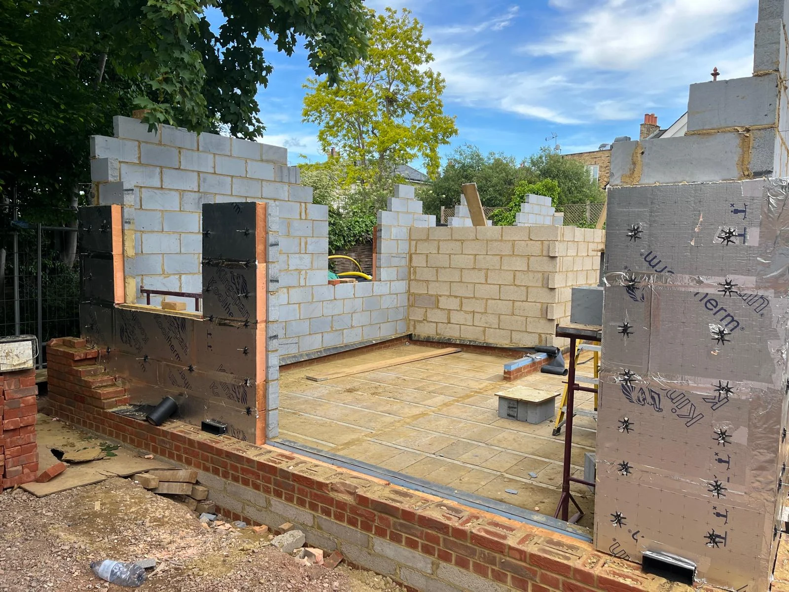 External walls taking shape, with cavity insulation in place.