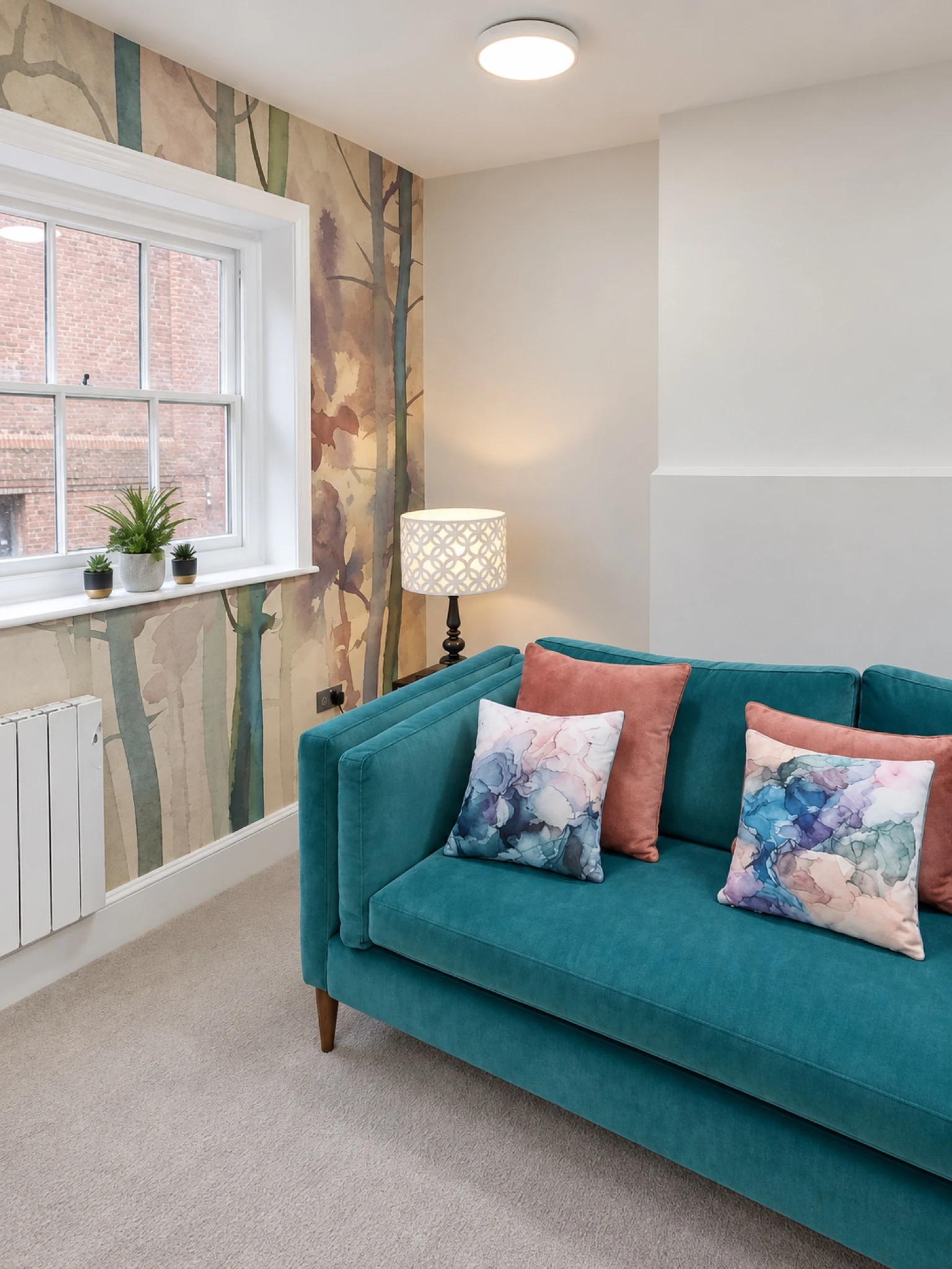 Window-side seating with a turquoise sofa.